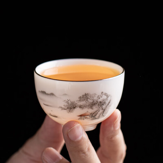 Gold inlaid jade Kung Fu tea set, complete set of home mutton fat jade porcelain drinking tea, tea gift box, high-end ink mountains and seas