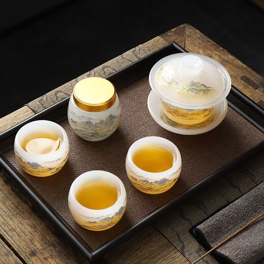 Beautiful and high-quality white jade glazed tea set Chinese style household jade porcelain Qianli Jiangshan light luxury Kung Fu tea set teapot one pot four cups Qianli Jiangshan covered bowl tea set white