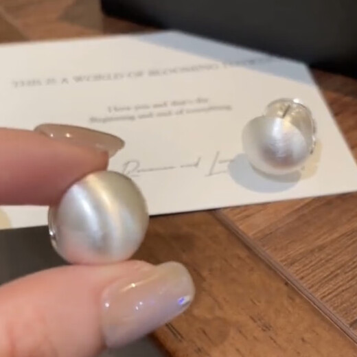 Weici sterling silver new style 9999 earrings brushed round ball earrings women's niche design high-end earrings 2025 new silver brushed round ball earrings A1312