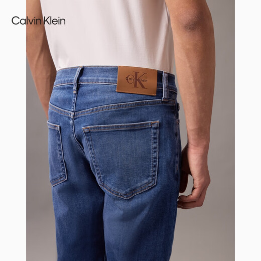 Calvin Kleinjeans 25 printemps et d'été Nouveau navette décontractée pour hommes CK Micro-élastique Jeans coniques en forme de coin 4RAB701 UL7-Denim Blue 32
