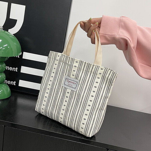 Bolsos de trabajo para mujeres 2025 Nuevos bolsos de hombro de moda y de moda para mujeres Ins japoneses versátiles pequeños de hombro para mujeres y1663 beige rayas blancas