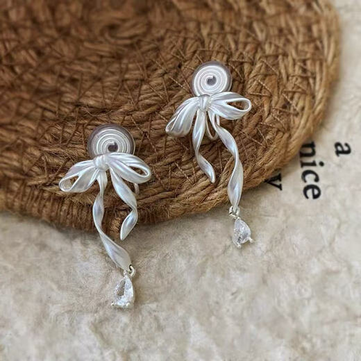 QMXD bow sweet ear clip for women without pierced ears sweet dream ballet girl feeling 2025 new exquisite mosquito coil earrings for women bow ear clip without pierced ears