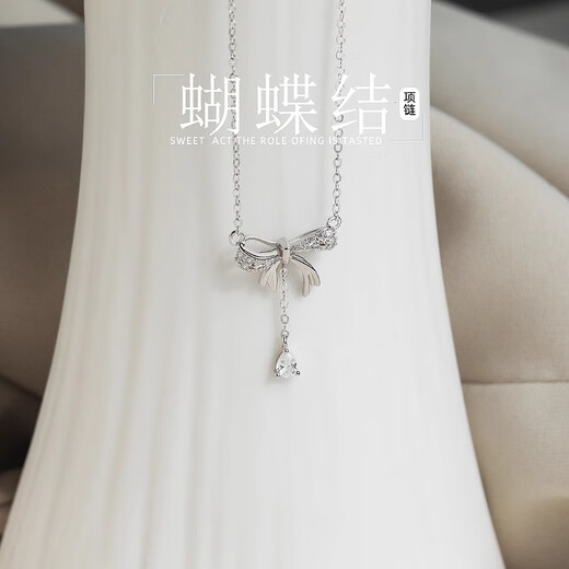 Xinshe 999 Collar de borla de arco de plata esterlina para mujeres Nuevos accesorios Ligeros de lujo Piso de plataforma de cumpleaños de alto nivel Cabeza de clavícula 999 Collar