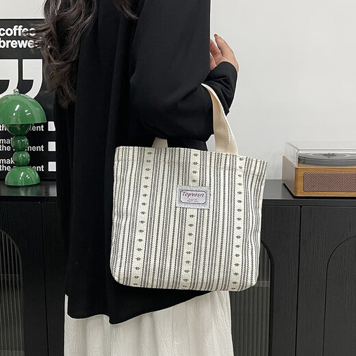 Bolsos de trabajo para mujeres 2025 Nuevos bolsos de hombro de moda y de moda para mujeres Ins japoneses versátiles pequeños de hombro para mujeres y1663 beige rayas blancas