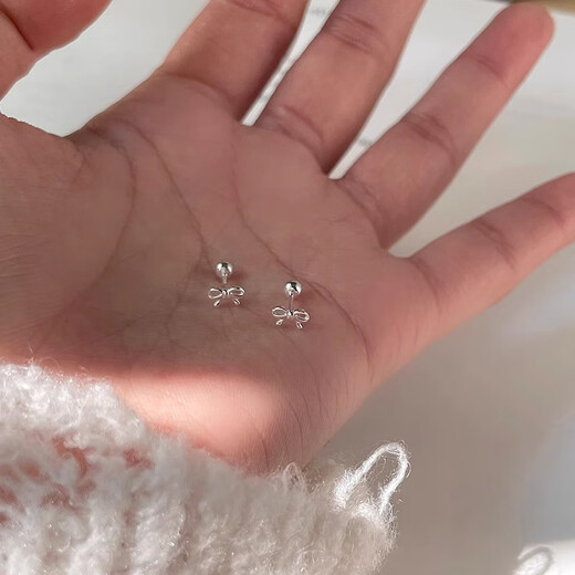 Xinshe S999 sterling silver earrings for women mini bow pure silver ear piercing 2025 new style sleeping-free earrings for women a pair of mini bow earrings
