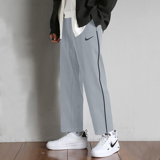 Pantalon de survêtement Nike (Nike) Pantalon pour hommes Summer Souffle à séchage rapide Pantalon de glace Pantalon à jambes droits Straitement Pantalon Men Tendance officielle Authentique DM6627-073_GRAY MODÈLE DE LEG STRIEUX_BREATABLE MBEATABLE M