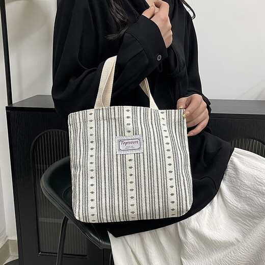 Bolsos de trabajo para mujeres 2025 Nuevos bolsos de hombro de moda y de moda para mujeres Ins japoneses versátiles pequeños de hombro para mujeres y1663 beige rayas blancas