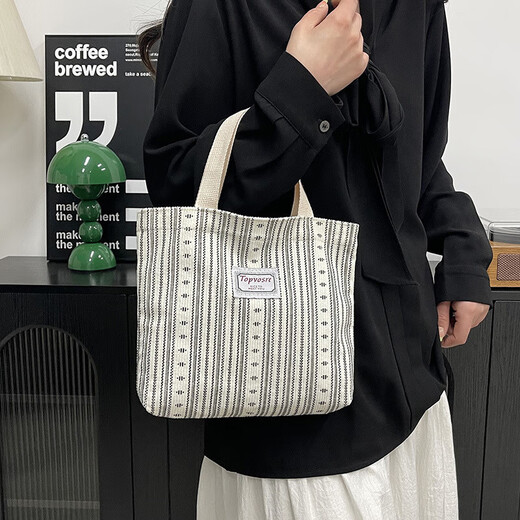 Bolsos de trabajo para mujeres 2025 Nuevos bolsos de hombro de moda y de moda para mujeres Ins japoneses versátiles pequeños de hombro para mujeres y1663 beige rayas blancas