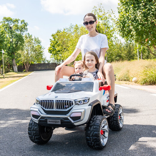Aobele children's electric car is a four-wheeled car that can seat adults and two children. It is a remote control stroller and a four-wheel drive off-road vehicle. It comes standard with white 12V7A battery + hard seat + hard wheels.