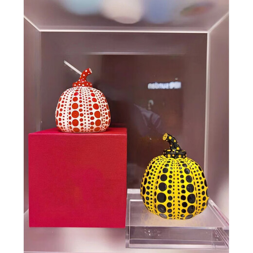 Yayoi Kusama pumpkin ornament sculpture with dense polka dots, yellow background and black dots 10x12 without label
