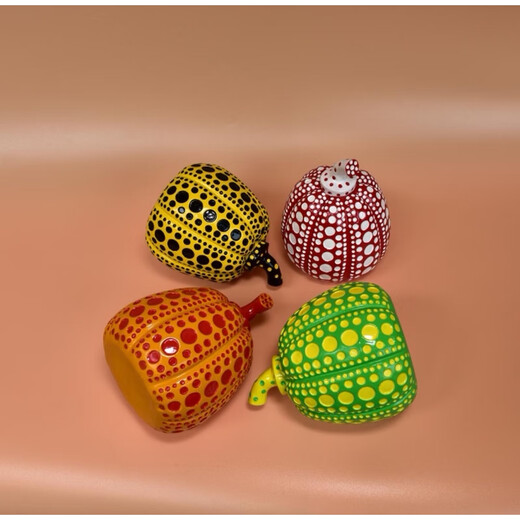 Yayoi Kusama pumpkin ornament sculpture with dense polka dots, yellow background and black dots 10x12 without label