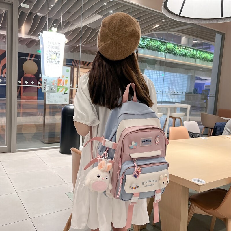 Double Star schoolbag primary school girls' schoolbags for grades 1, 2, 3 to 6, large-capacity sports burden-reducing backpack, large blue size with round rabbit pendant