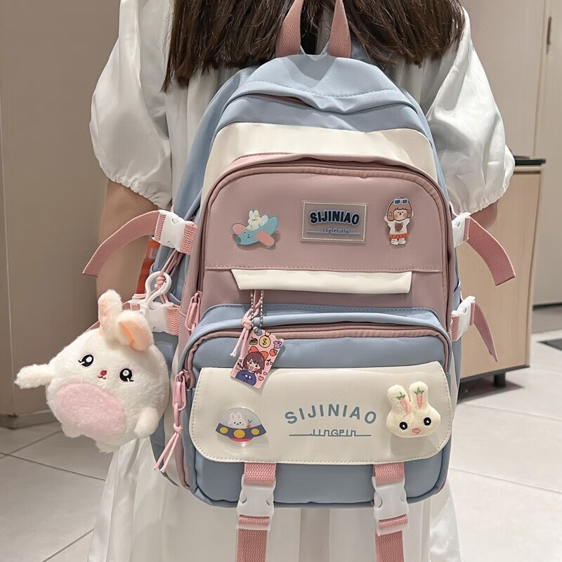 Double Star schoolbag primary school girls' schoolbags for grades 1, 2, 3 to 6, large-capacity sports burden-reducing backpack, large blue size with round rabbit pendant