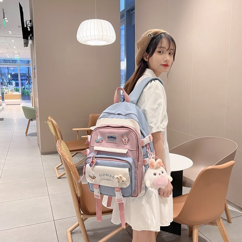 Double Star schoolbag primary school girls' schoolbags for grades 1, 2, 3 to 6, large-capacity sports burden-reducing backpack, large blue size with round rabbit pendant