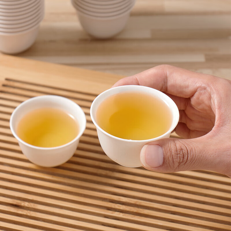 Baijie disposable tea cup Kung Fu tea 60ml degradable rice husk cup high-end heat-resistant tea cup 100 pieces + cup holder