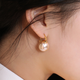 Idel's high-end earrings queen style niche imitation large pearl earrings stud earring buckle 2025 new trend E0628 gold_champagne gold earrings