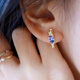 Shilian Beidao Iris high-end light luxury daily versatile commuting sterling silver inlaid natural tanzanite stud earrings