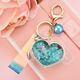 
School bag hanging chain for women creative acrylic into oil bottle quicksand love keychain glitter pink peach heart women Korean cute jewelry pink + fantasy beads + short fantasy color rope quicksand love heart