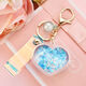 
School bag hanging chain for women creative acrylic into oil bottle quicksand love keychain glitter pink peach heart women Korean cute jewelry pink + fantasy beads + short fantasy color rope quicksand love heart