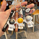 Feihui Internet celebrity creative astronaut keychain, male and female couples' school bag pendant birthday gift, orange astronaut