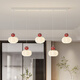 Zhuansi Restaurant Chandelier minimaliste Long Strip Designer 5-HEAD CRAME Style Dining Table Lampe de salle à manger simple MODER
