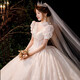 Robe de mariée de maquillage rouge 2025 Nouvelle mariée Princesse Puff Sleeve luxueuse Palace Style Tail Français Robe de mariée principale Light Champagne Slat S