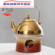 La lampe d'alcool Thé chaudière poêle alcool mec mec rafraîchissement de thé maison restaurant isolé thé bouillonnant bouillonnement clôture de bouette de boulange