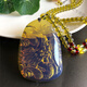 SNQP blue amber pendant Dominica changes color when exposed to natural light, internal carving, amber beeswax pendant necklace, sweater chain, Pisces Playing Lotus + chain