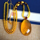 Core fragrant amber with scriptures carved inside, beeswax Heart Sutra, gold amber with Guanyin carved blue amber water drop pendant, egg-faced Buddha Wushi brand for men and women, gold amber with heart sutra carved with lotus + bead chain, default