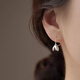 Qi Xiaomi 999 pure silver flower earrings for girls, pierced earrings 2025 new light luxury niche high-end ear jewelry 999 silver magnolia flower earrings price of two