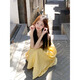 Robe jaune de style doux xier pour femmes sur la plage de style vacances à suspension jupe atmosphère en jupe tempérament A-line jupe longue jaune l