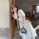 Yuan nacionalidad Diseño con volantes Falda irregular para mujeres en verano 2025 Nuevo francés romántico pequeño vestido largo 6627 leche blanca l