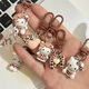 
Leopard print cartoon KT keychain brown autumn and winter retro cat school bag pendant ins style sweet cool hanging decoration cute glasses standing-light leopard print KT
