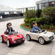 Kangshuai Aibeimei children's electric car, four-wheeled, can be made into a human being, with remote control, can be driven, a toddler toy car, 1-5 years old, electric car for children with red paint, leather seat + remote control + 12V7A + trunk