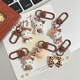 
Leopard print cartoon KT keychain brown autumn and winter retro cat school bag pendant ins style sweet cool hanging decoration cute glasses standing-light leopard print KT