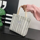 Bolsos de trabajo para mujeres 2025 Nuevos bolsos de hombro de moda y de moda para mujeres Ins japoneses versátiles pequeños de hombro para mujeres y1663 beige rayas blancas