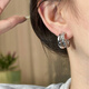 French retro high-end earrings, feminine commuter earrings, simple semicircular hollow line heavy earrings, gold