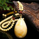 Mu Huanshi wax beeswax pendant sweater chain natural amber raw stone chicken fat yellow water drop necklace for men and women (with national inspection certificate) black material water drop pendant with fashionable cotton rope style