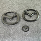 Manman eignet sich für Mazda 6 Atez Vorder- und Heck -Logo Lenkrad Logo Modifiziertes schwarzes Aussehen bedeckt dekoratives Logo 1416 Atez vordere und hintere Logo hell Schwarz