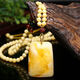 Mu Huanshi wax beeswax pendant sweater chain natural amber raw stone chicken fat yellow water drop necklace for men and women (with national inspection certificate) black material water drop pendant with fashionable cotton rope style