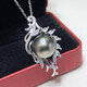 Fashion Tahitian seawater black pearl pendant, round and bright design, fashionable and elegant, showing the charm of the upper body.