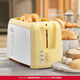 Holstein Housewares Yellow 2-Slice Toaster 7-stage toasting Extra-wide slots Removable crumb tray High lift Defrost function
