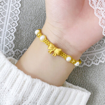 老凤祥金在逃公主蝴蝶结手链女转运珠官方编织本命年珍珠手绳金浪漫