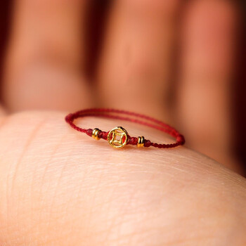 老凤凰老凤凰黄金小钱币戒指女足金999铜钱本命年红绳戒指手工编织手