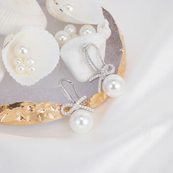 周宝福s999纯手工银耳钉锆石小众设计感淡水珍珠耳环女百搭现货2024